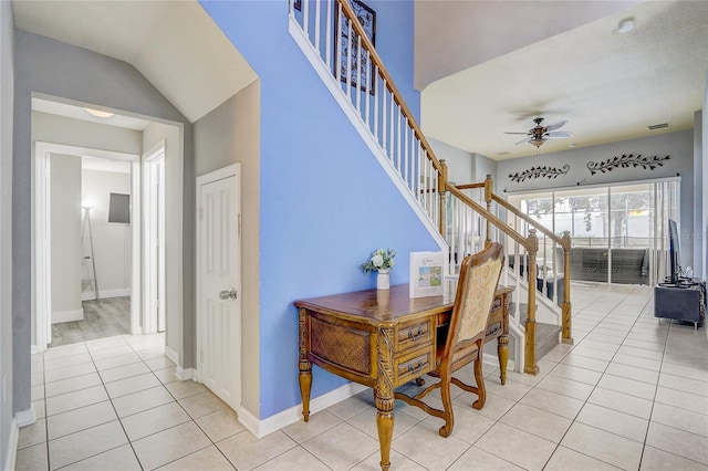 interior space featuring tile patterned flooring and ceiling fan