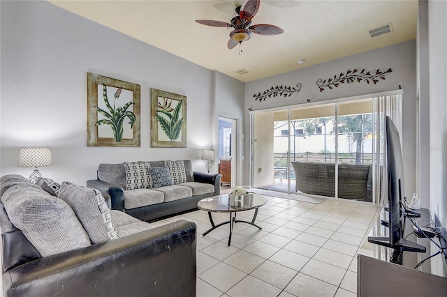 living room featuring ceiling fan and light tile patterned floors