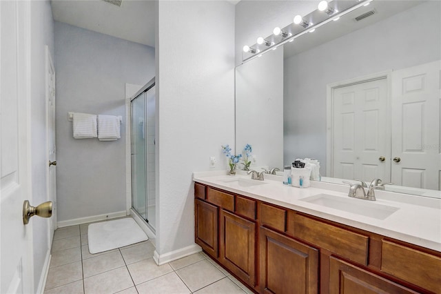 bathroom with vanity, tile patterned floors, and an enclosed shower