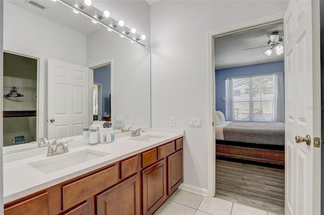 bathroom with ceiling fan, hardwood / wood-style floors, and vanity