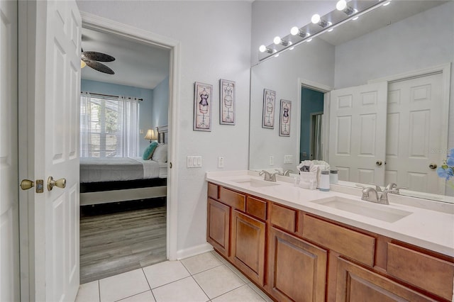 bathroom featuring ceiling fan, vanity, and wood-type flooring