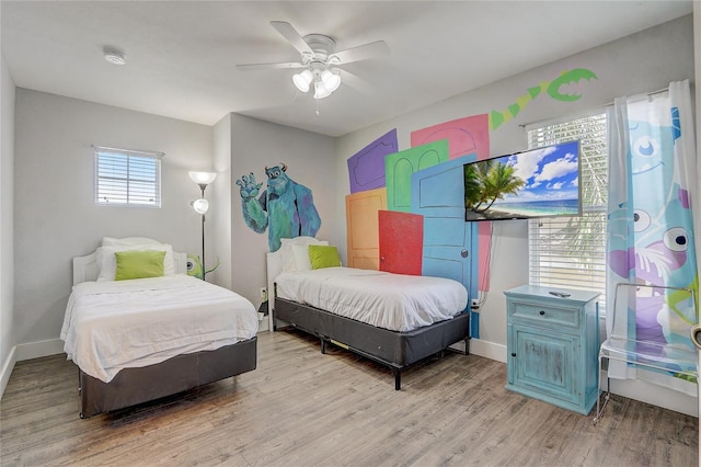 bedroom with ceiling fan and light wood-type flooring