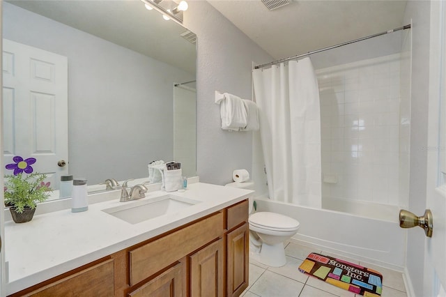 full bathroom featuring tile patterned floors, shower / bath combo with shower curtain, vanity, and toilet