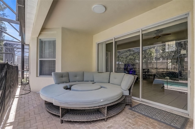 view of patio / terrace featuring glass enclosure and an outdoor hangout area