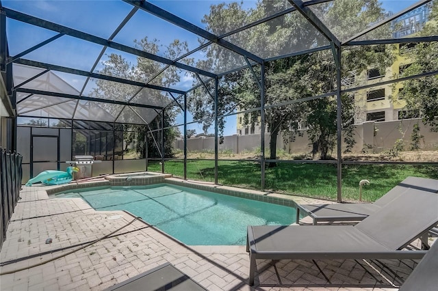 view of pool featuring a lawn, a patio area, a lanai, and an in ground hot tub