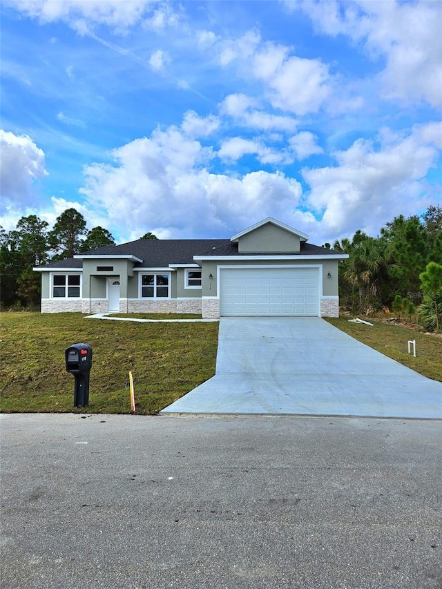 ranch-style home with a garage and a front lawn