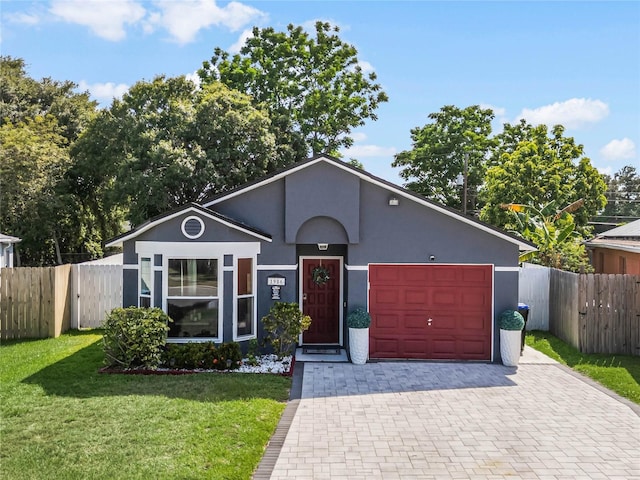 view of front of house with a front lawn and a garage