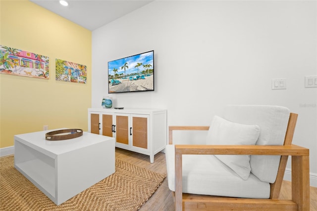 living area with light hardwood / wood-style floors