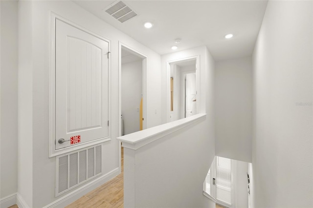 corridor featuring light hardwood / wood-style floors