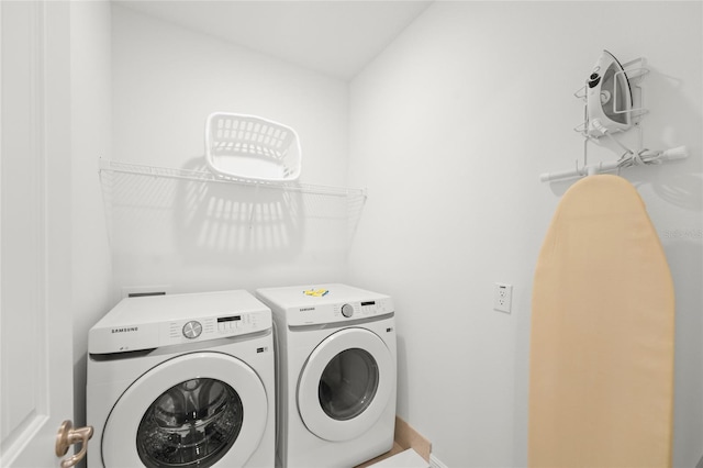 laundry room featuring separate washer and dryer