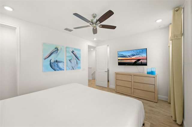 bedroom featuring light hardwood / wood-style flooring and ceiling fan