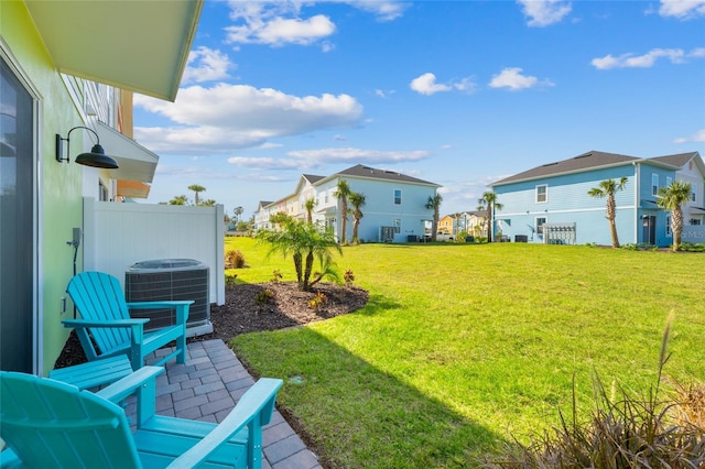 view of yard with a patio area and central air condition unit