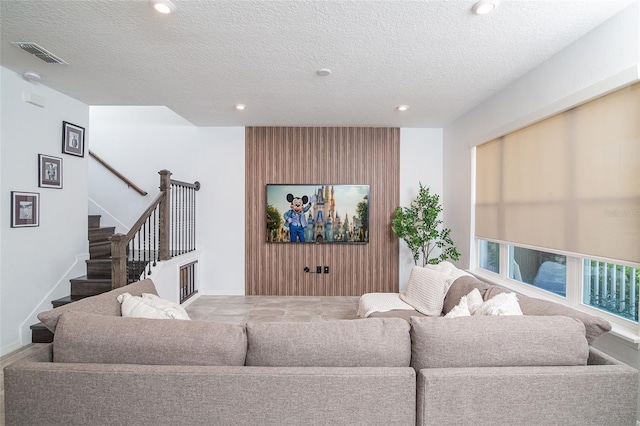 living room with a textured ceiling