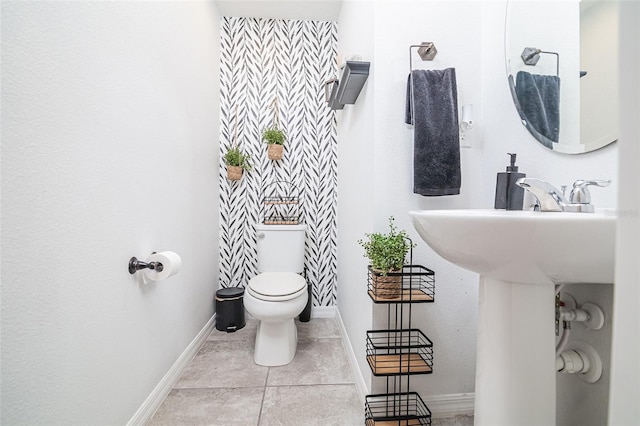 bathroom featuring tile patterned floors and toilet