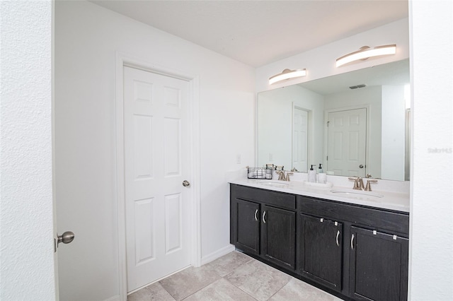 bathroom with vanity and tile patterned floors