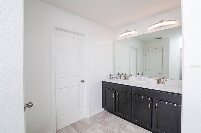 2135 Valencia Blossom St, Clermont, FL 34711 - bathroom with double vanity and tile patterned flooring