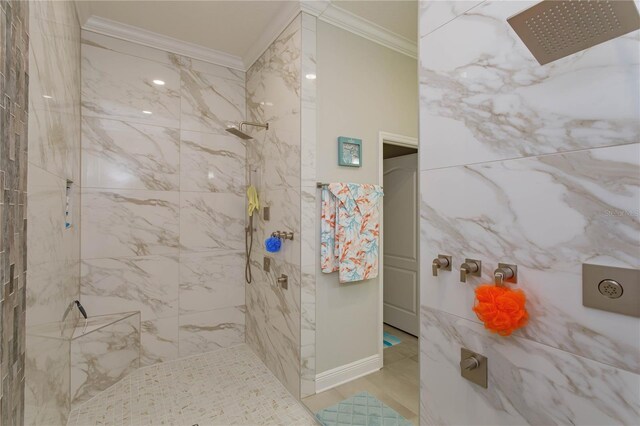bathroom with ornamental molding, a marble finish shower, and baseboards