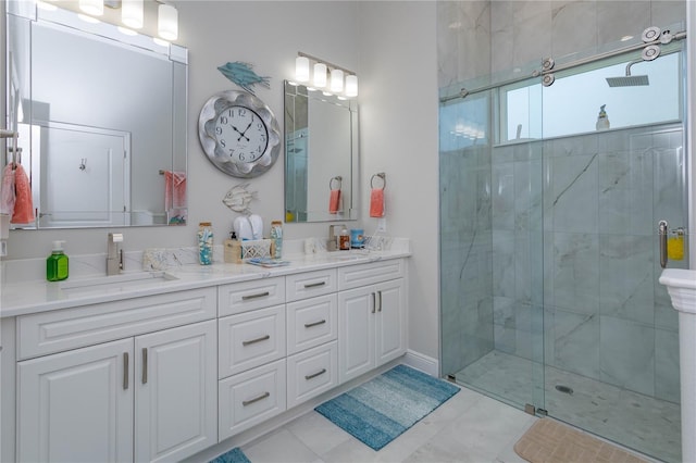 bathroom featuring a shower stall and double vanity