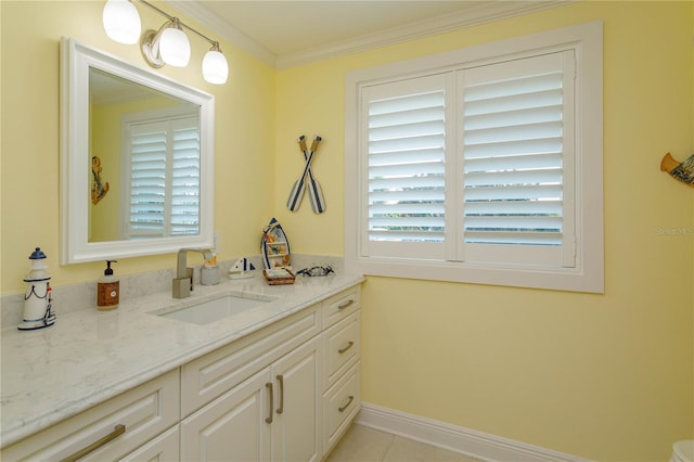 bathroom featuring tile patterned floors, crown molding, and vanity