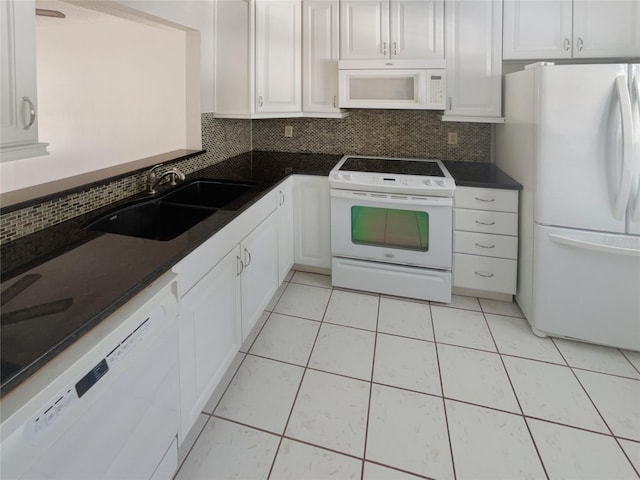 kitchen with white cabinetry, white appliances, sink, and tasteful backsplash