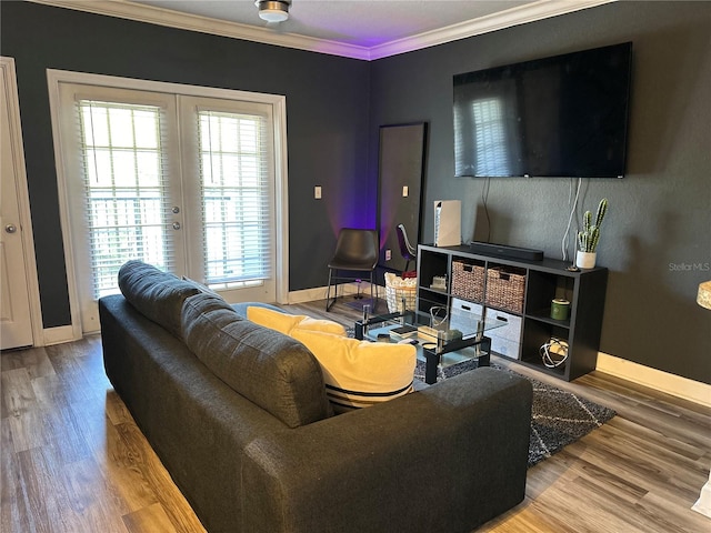 living room featuring french doors, ornamental molding, and wood-type flooring