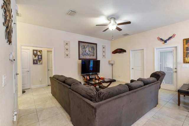 living room with ceiling fan and light tile patterned flooring