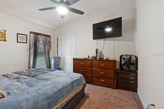 bedroom featuring ceiling fan, lofted ceiling, and light colored carpet