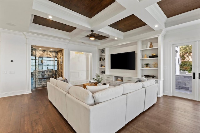 living room with dark hardwood / wood-style floors, ceiling fan, ornamental molding, and coffered ceiling