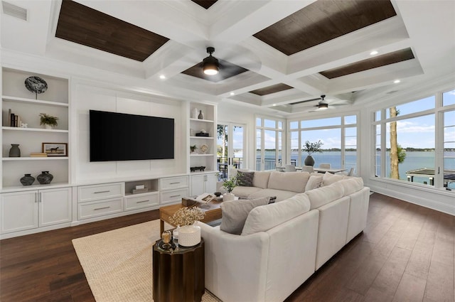 living room with dark wood-type flooring, coffered ceiling, ceiling fan, built in shelves, and beam ceiling