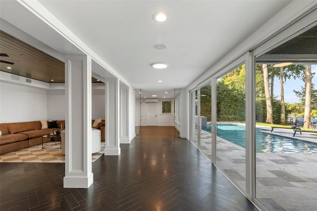 corridor featuring recessed lighting and a wall mounted AC