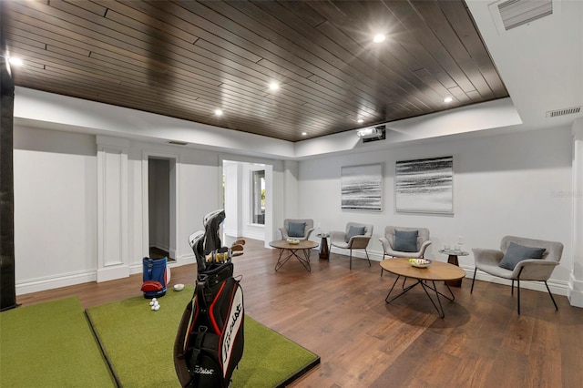 living area with wood ceiling, recessed lighting, wood finished floors, and visible vents