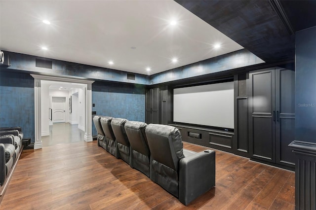 home theater room with recessed lighting and dark wood finished floors