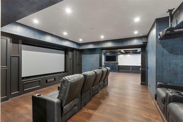 home theater with recessed lighting and dark wood-style floors