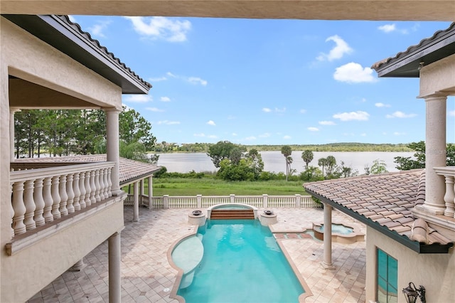 view of pool featuring a water view and a patio