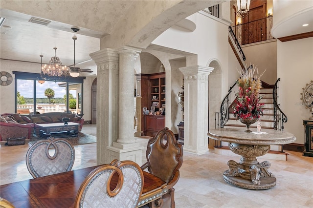 interior space with ornate columns and a notable chandelier