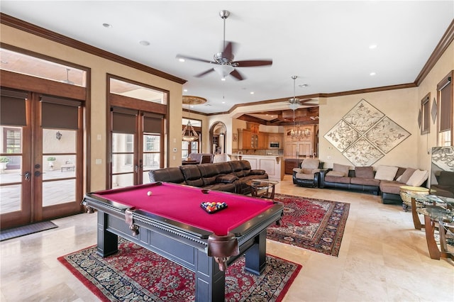 rec room with ceiling fan, ornamental molding, a wealth of natural light, and french doors