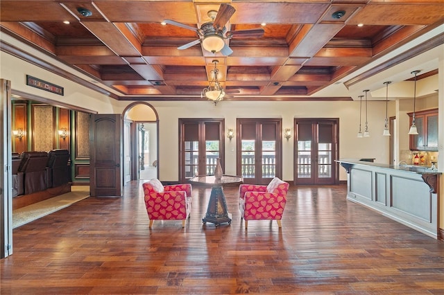 interior space featuring french doors, coffered ceiling, and a healthy amount of sunlight