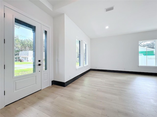 entryway with light hardwood / wood-style flooring