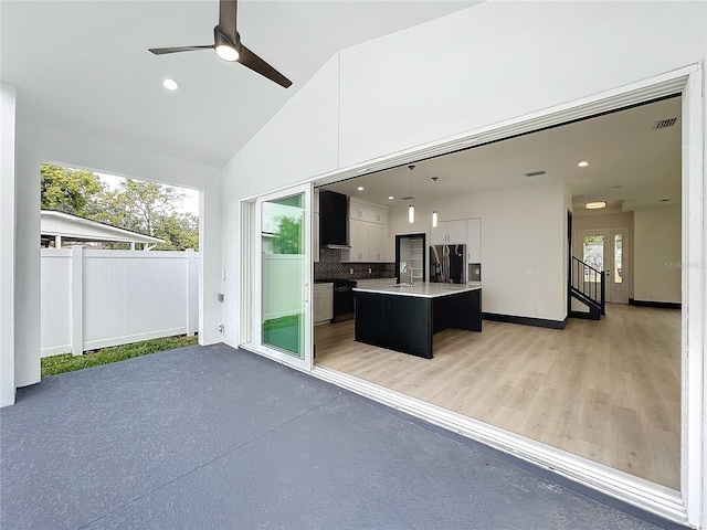 view of patio / terrace with ceiling fan and sink