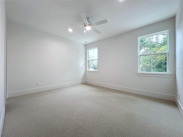 unfurnished room featuring carpet and ceiling fan