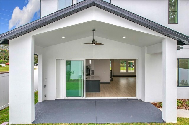 entrance to property with ceiling fan