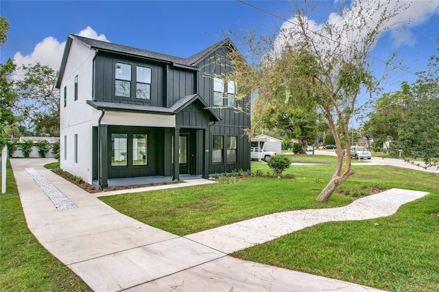 view of front of home with a front lawn