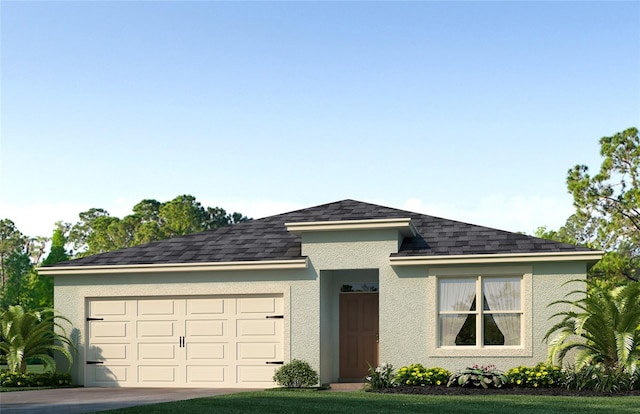 view of front of home featuring a garage and a front yard