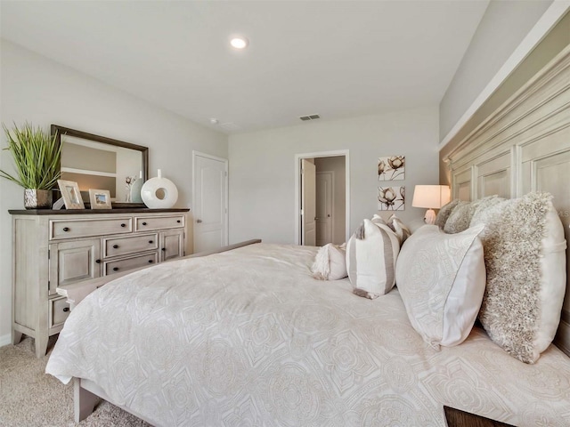 bedroom with light colored carpet