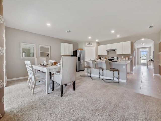 dining room with light tile patterned flooring