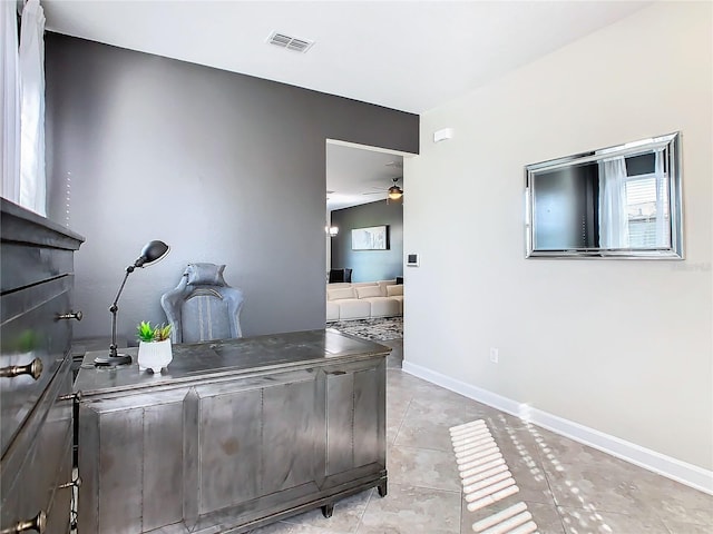 office area with ceiling fan and light tile patterned floors