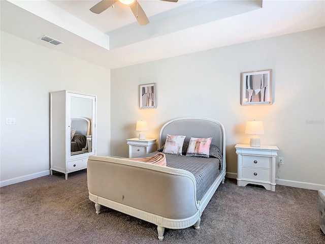 bedroom featuring dark carpet and ceiling fan