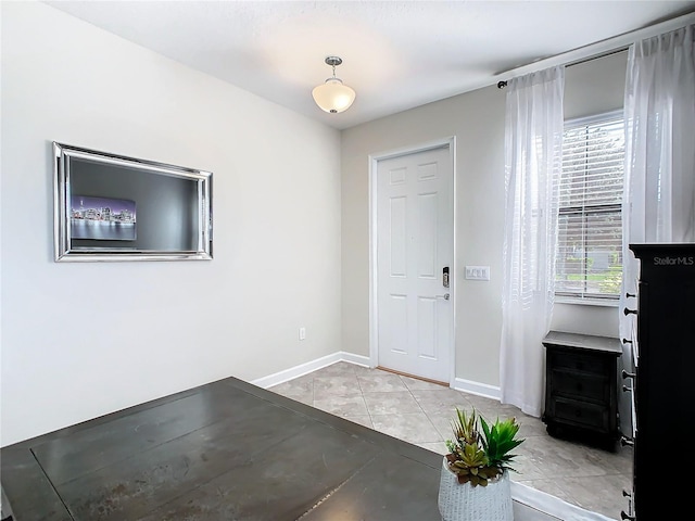 entryway featuring light tile patterned floors