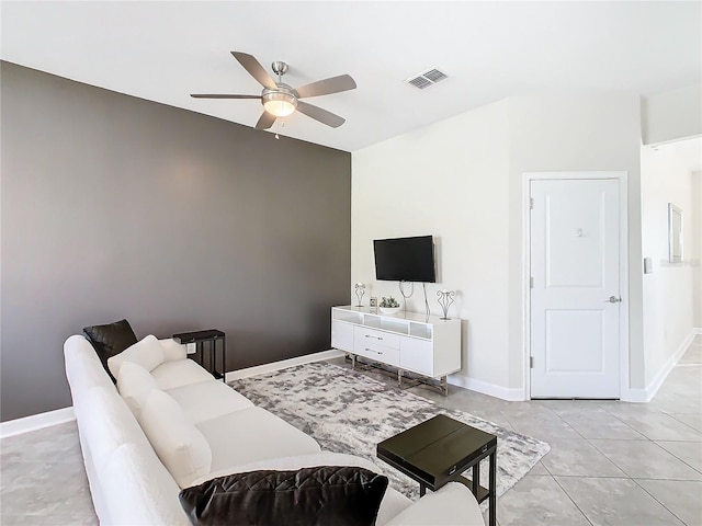 tiled living room featuring ceiling fan