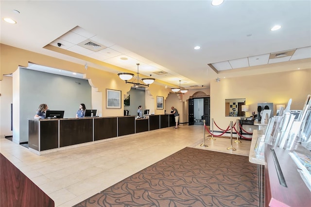 reception area with a notable chandelier